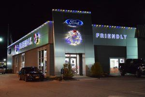 New York dealership with Christmas decorations, lights and animated displays.