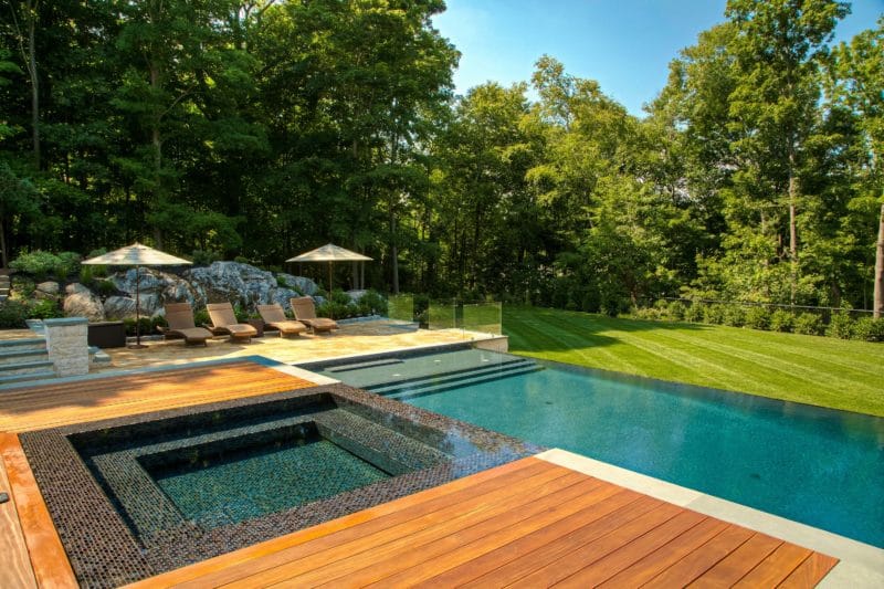 View of woodland area with infinity pool that helped boost property value and visual appeal 