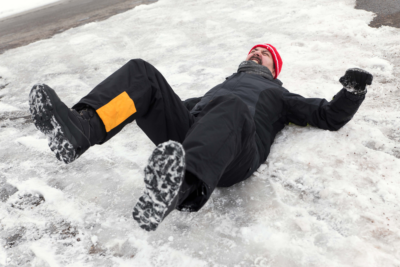 Man slips and fall on walkway because of snow. One of the mistakes commercial property owners does is that they forget about the snow removal plan which leads to failing to use salt or ice melts after removing as much snow possible